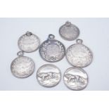 Seven silver fob medallions relating to "First Army Rifle Meeting" and The Army Rifle Association,