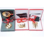 Three Georg Jensen Christmas ornaments, gold electroplated brass for the years 2004, 2005, and 2006,