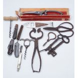 A 19th Century sugar loaf cutter, poultry sheers, antique keys, pocket knives, corkscrews, etc.