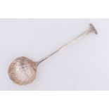 An early George III Onslow pattern silver spoon, having a shell form bowl, possibly Thomas and