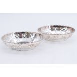 A pair of 1920s pierced silver oval bon bon dishes, having pierced reticulated sides, Birmingham,