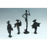 A set of three contemporary cast iron figurines of Japanese ladies, together with a contemporary