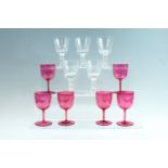 Six late 19th Century cranberry wine glasses, each having wheel cut engraved ferns to the top of the