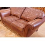 A contemporary brown hide sofa, 210 cm wide x 100 cm high
