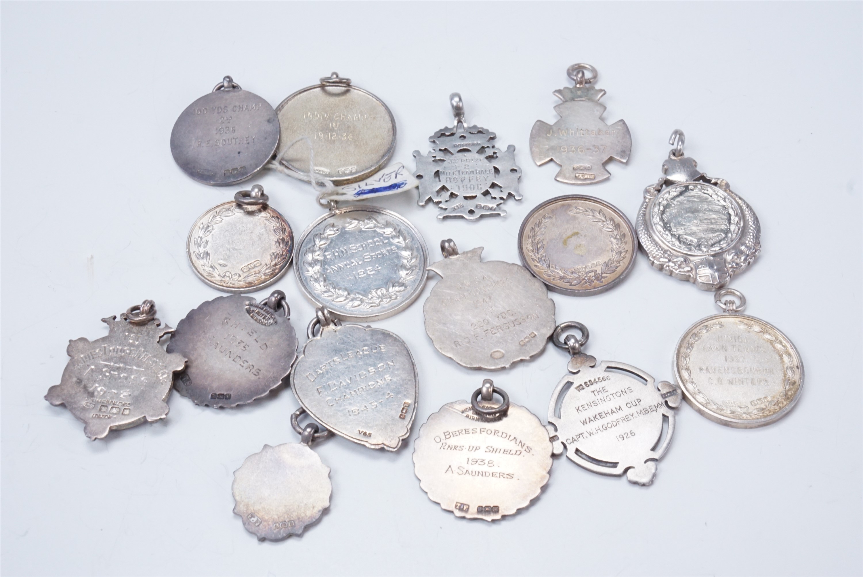 16 silver and enamelled silver fob medallions relating to sport, including athletics, swimming, - Image 2 of 2