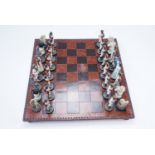 A Napoleonic themed chess set, king 10 cm