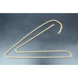 An early 20th Century yellow metal rope link princess necklace, marked '10k', 6.43 g, 43 cm