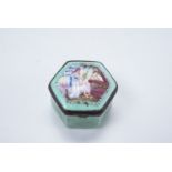 An 18th Century Bilston enamel pill box, of hexagonal form, the top having a classical lady in a