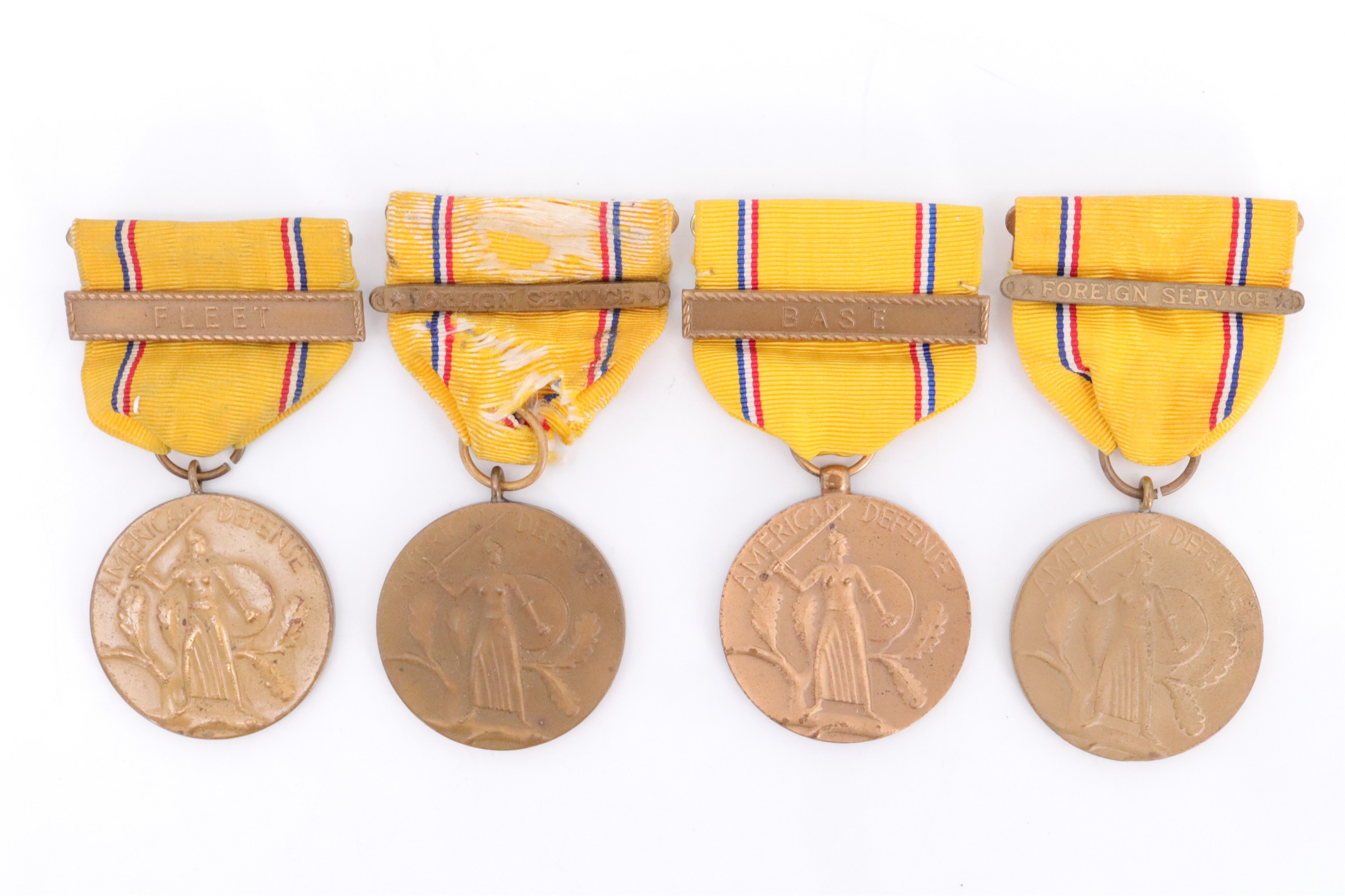 Four US American Defense Service Medals with clasps