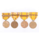 Four US American Defense Service Medals with clasps