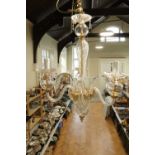 An as-new French three branch crystal chandelier, approximately 49 x 65 cm, excluding the chain