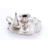 A fine Victorian silver chamber candlestick, having a cast nozzle, the square base having canted