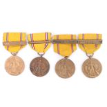 Four US American Defense Service Medals with clasps