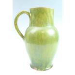 A late 19th Century earthenware jug, 32 cm