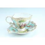 A 19th Century Dresden cabinet cup and saucer, having floral decoration and classical scenes of