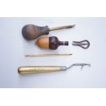 A small group of sewing accessories, including an acorn form thimble holder etc
