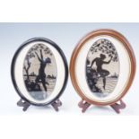 A near pair of petit point silhouettes each of a lady beside a tree, both 26 x 14 cm sight size