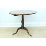 An early 19 century oak tilt top occasional table, having latter additions, 63 x 58 cm
