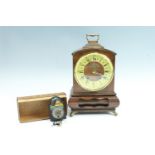 A 1980s Warmink walnut bracket clock, the double train movement striking on a bell, key present, and