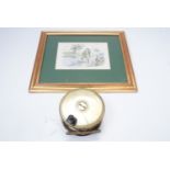 A 19th Century 4 1/2" brass fishing reel, together with a humorous print relating to fishing
