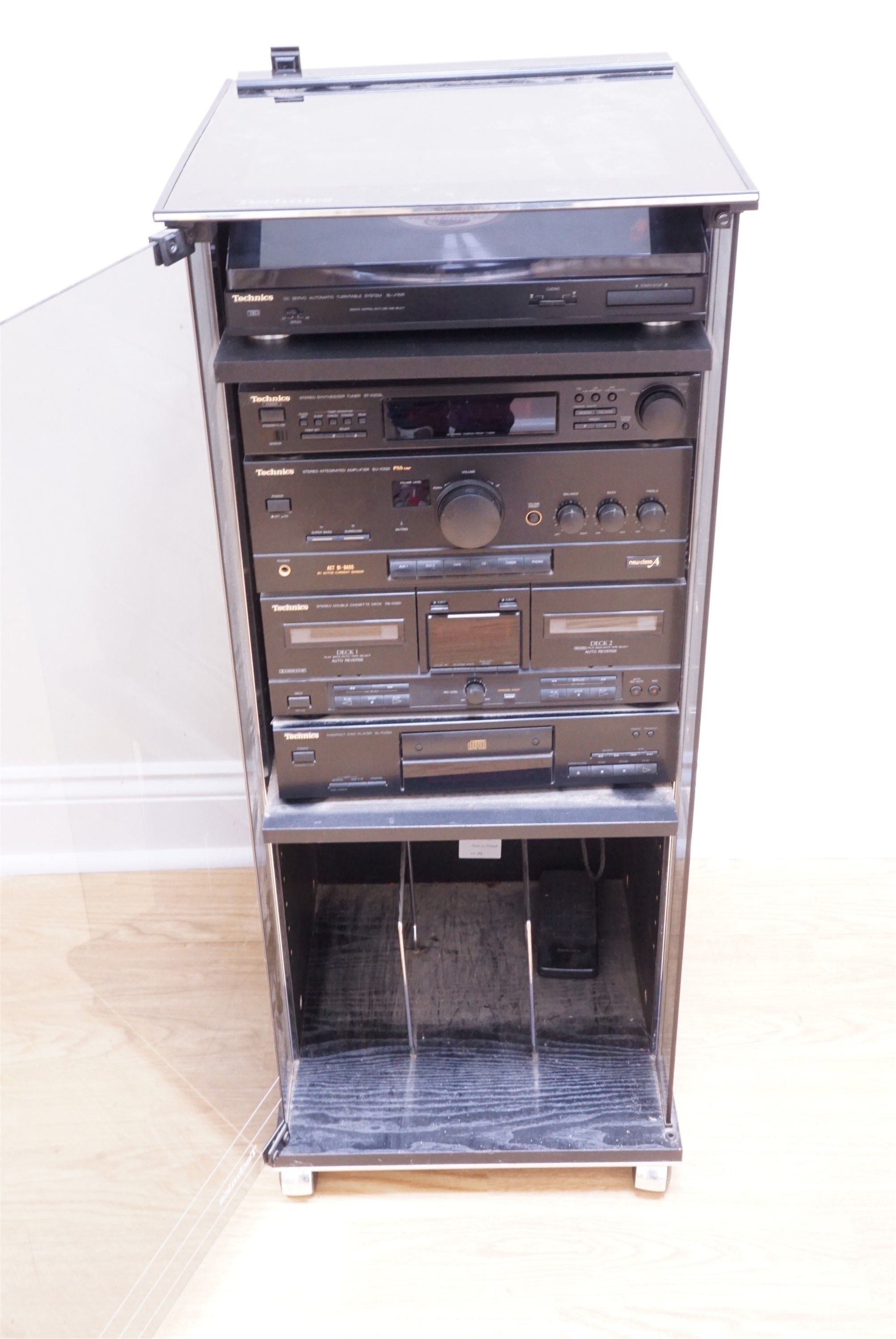 A Technics hi-fi system including compact disc player SL-PJ28A, stereo double cassette deck RS-X320,