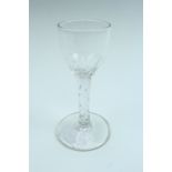 A late 18th Century facet-cut wine glass, 14 cm