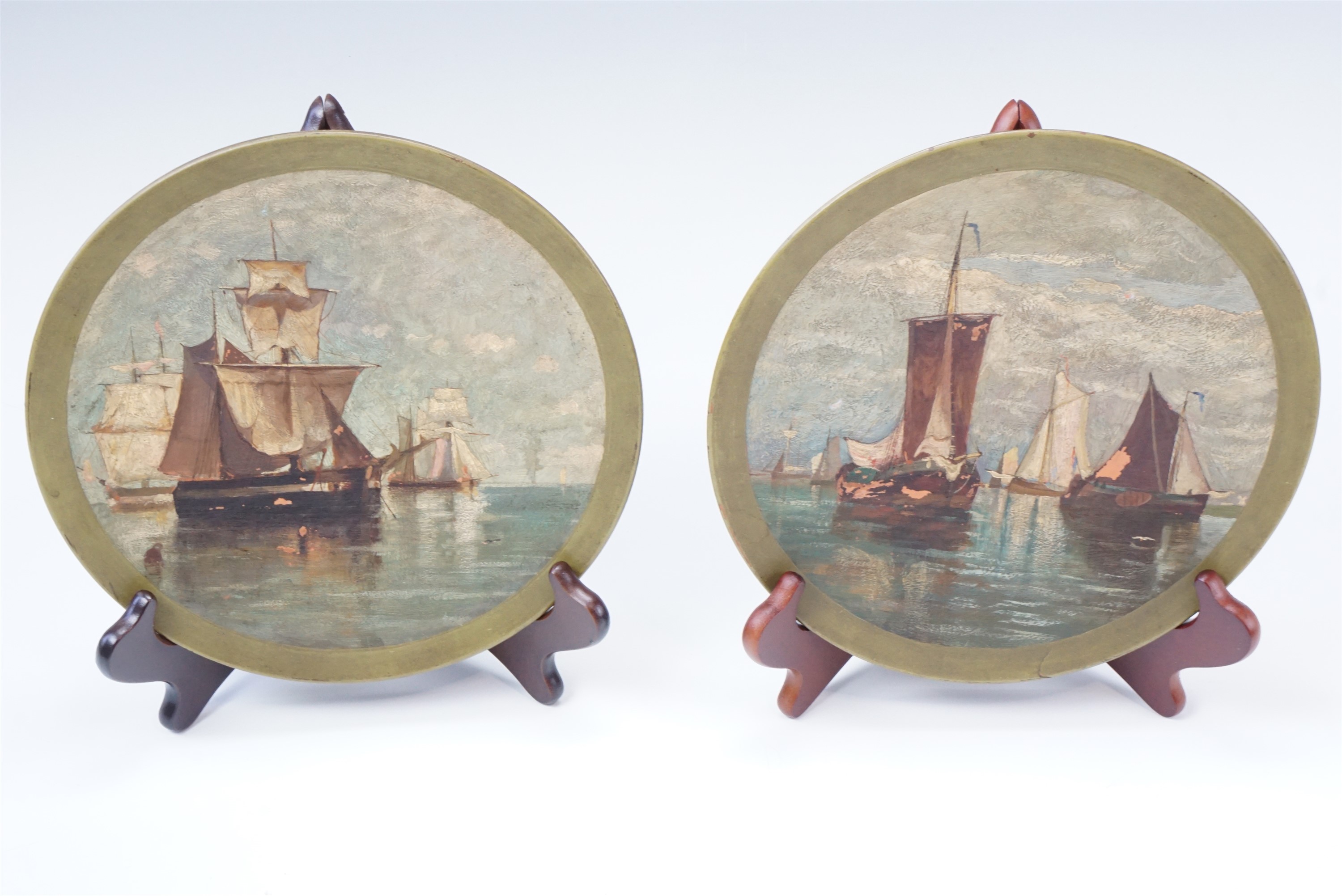 Two Victorian Scottish terracotta plaques, hand painted in oils with maritime scenes, impressed