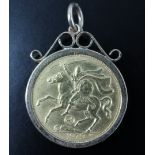 A 1979 Isle of Man half sovereign in a 9 ct gold pendant frame, 5.45 g, 30 mm including the bail