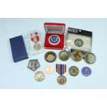 A number of US military commemorative "coins", together with a War on Terrorism Medal and one other
