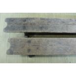 A pair of late 19th / early 20th Century pitch pine benches, 31 cm high x 352 cm long