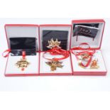 Three Georg Jensen Christmas ornaments, gold electroplated brass for the years 2001, 2002, and 2003,