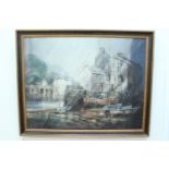 The harbour at Polperro, a sun raked serene view of the harbour with boats in mud berths, looking