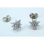 A pair of diamond and platinum star burst stud earrings by Boodles, from their Cabaret collection,