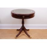 A reproduction Georgian mahogany drum-top sabre-legged occasional table, 55 cm x 63 cm