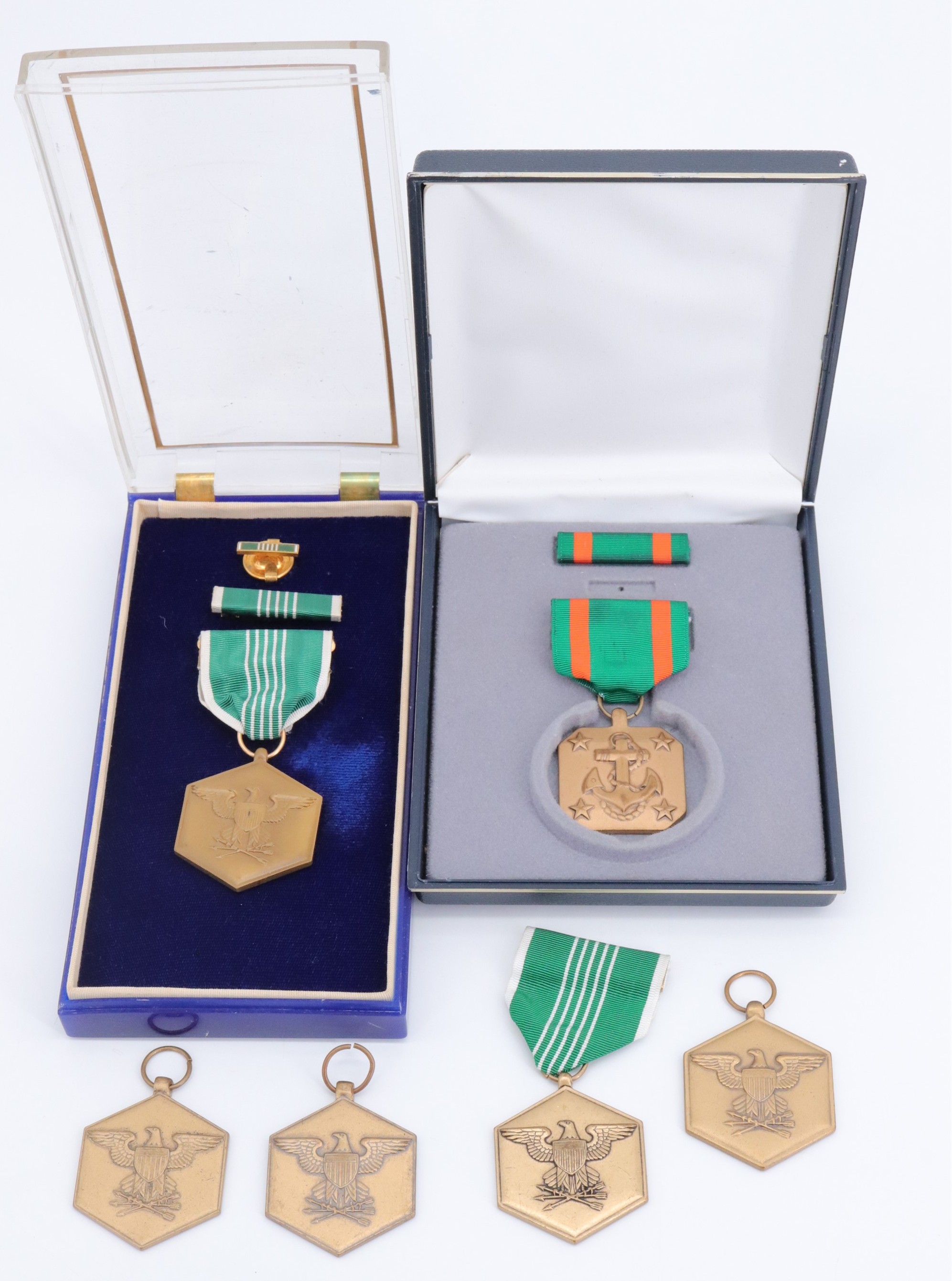 A US Army Commendation Medal together with a Navy and Marine Corps Achievement Medal, cased, and