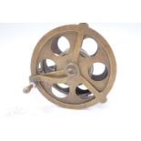 A brass 5" centre pin fishing reel