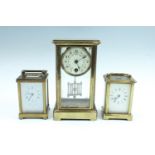 Two brass carriage clocks, comprising an early 20th Century clock in a corniche case, key lacking,