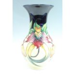 A Moorcroft "Anna Lily" pattern vase, dated "98", 34 cm