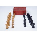A boxed set of turned and carved wood chess pieces, kings 7.5 cm
