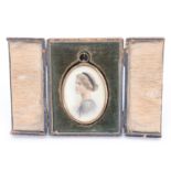 A 1920s portrait miniature of a young lady, in an oval gilt frame with a suspender, in a fitted silk