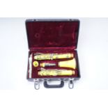 A late 20th Century cased neon yellow five piece clarinet by 'DY Musical Design in USA'