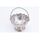 A Victorian pierced silver swing handled bon-bon / sweetmeat basket, having pieced floral decoration