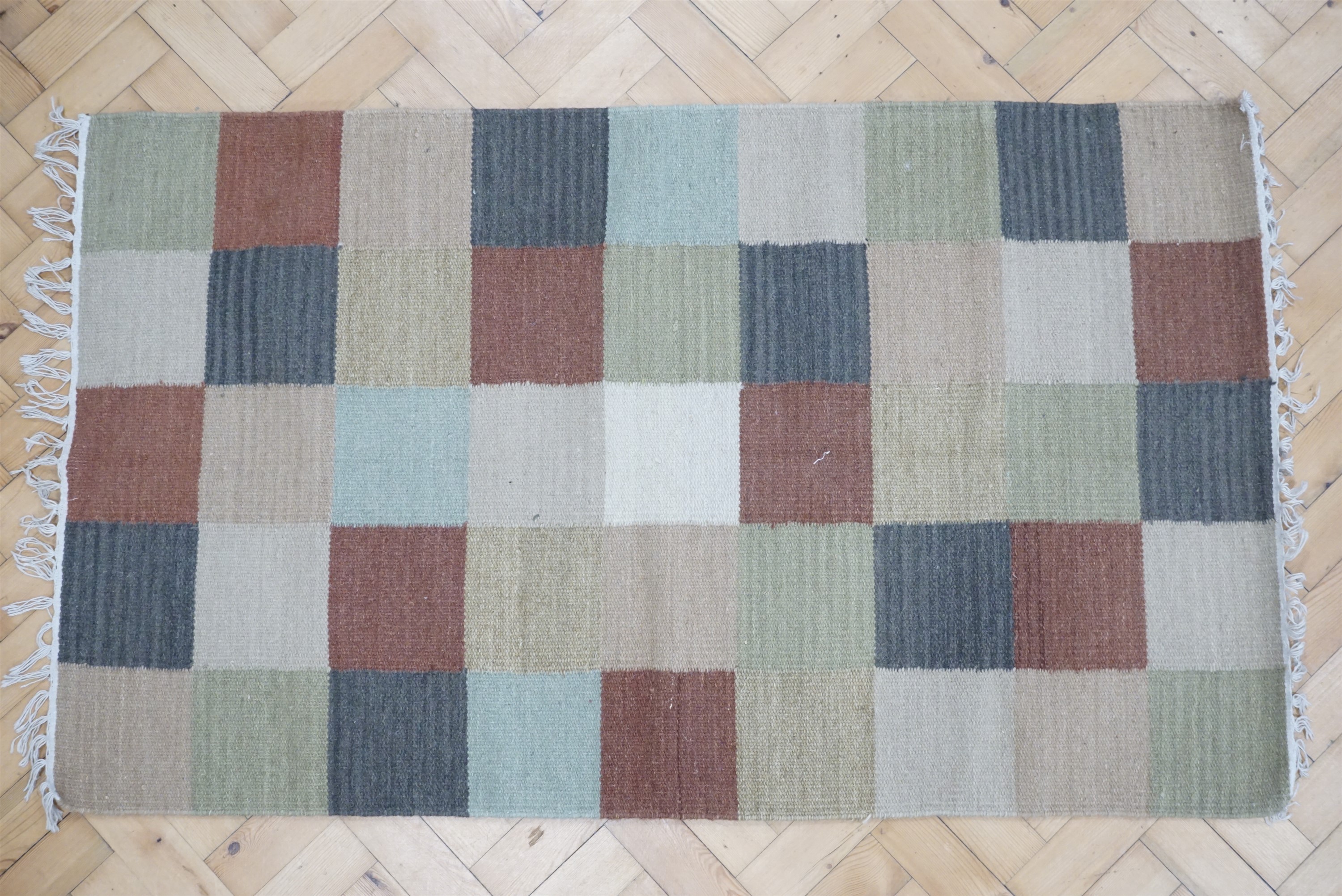 A hessian rug, 150 x 87 cm