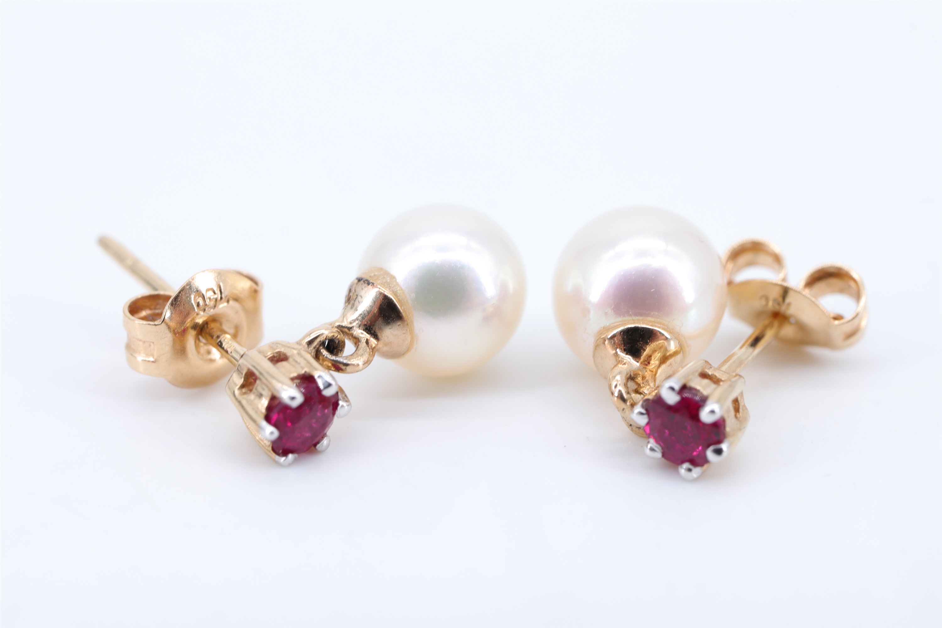 A pair of ruby and pearl ear pendants, the pearls of approx 6 mm, set on 18 ct yellow metal - Image 2 of 3