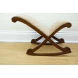 An upholstered gout stool