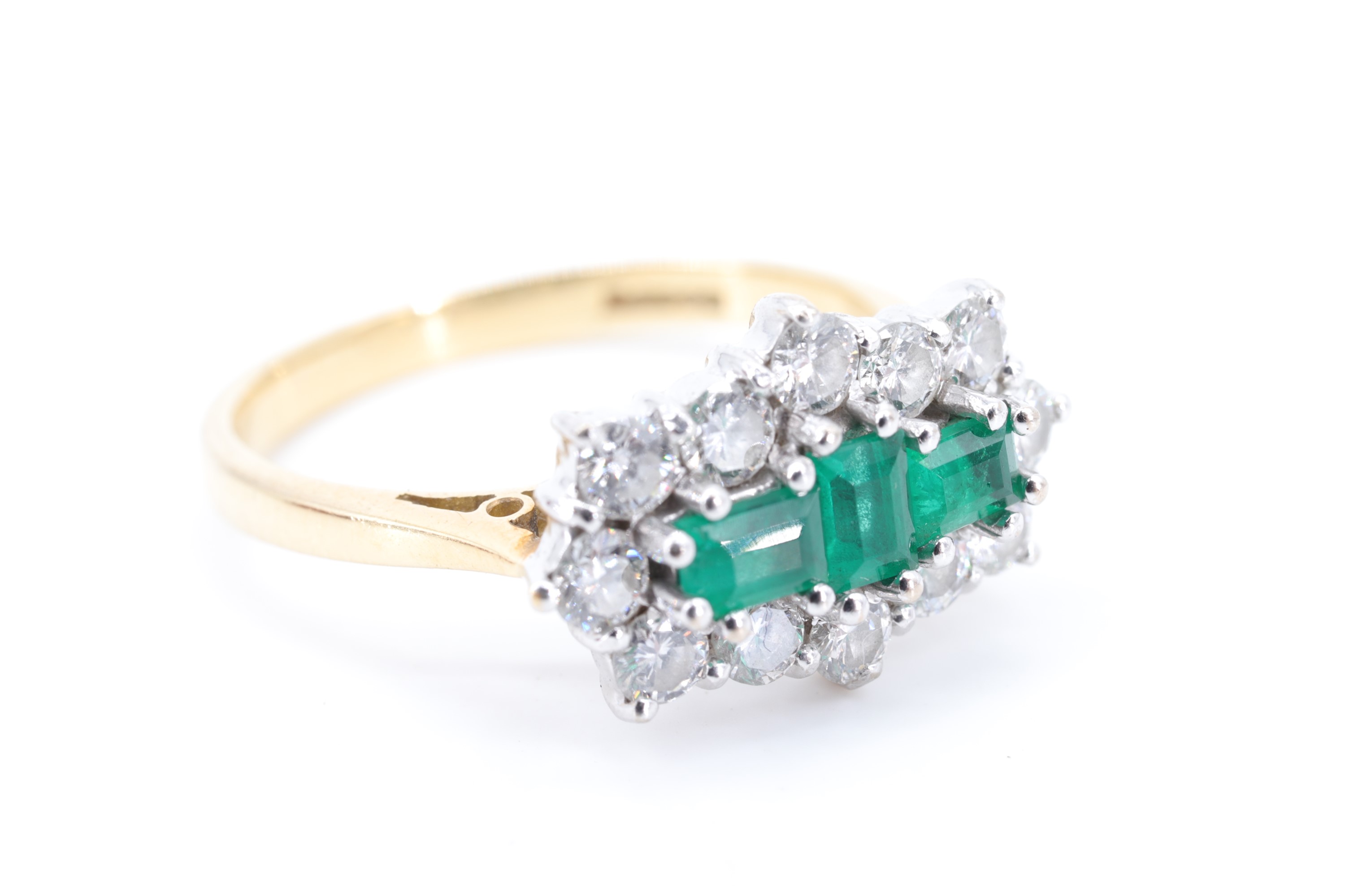 A fine emerald and diamond ring, comprising a pair of baguette-cut emeralds divided by one other set - Image 2 of 6