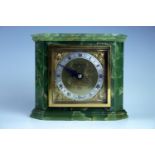 An Elliott onyx mantle clock, 17 cm x 14 cm high, (running when catalogued, accuracy and reliability