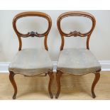 A pair of Victorian mahogany balloon-back dining chairs