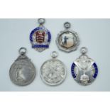 Four silver and enamelled silver target shooting fob medals, including Middlesex Small Bore Rifle