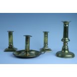 A pair of small late Georgian brass candlesticks, push-eject with lead weighted bases, 12 cm,